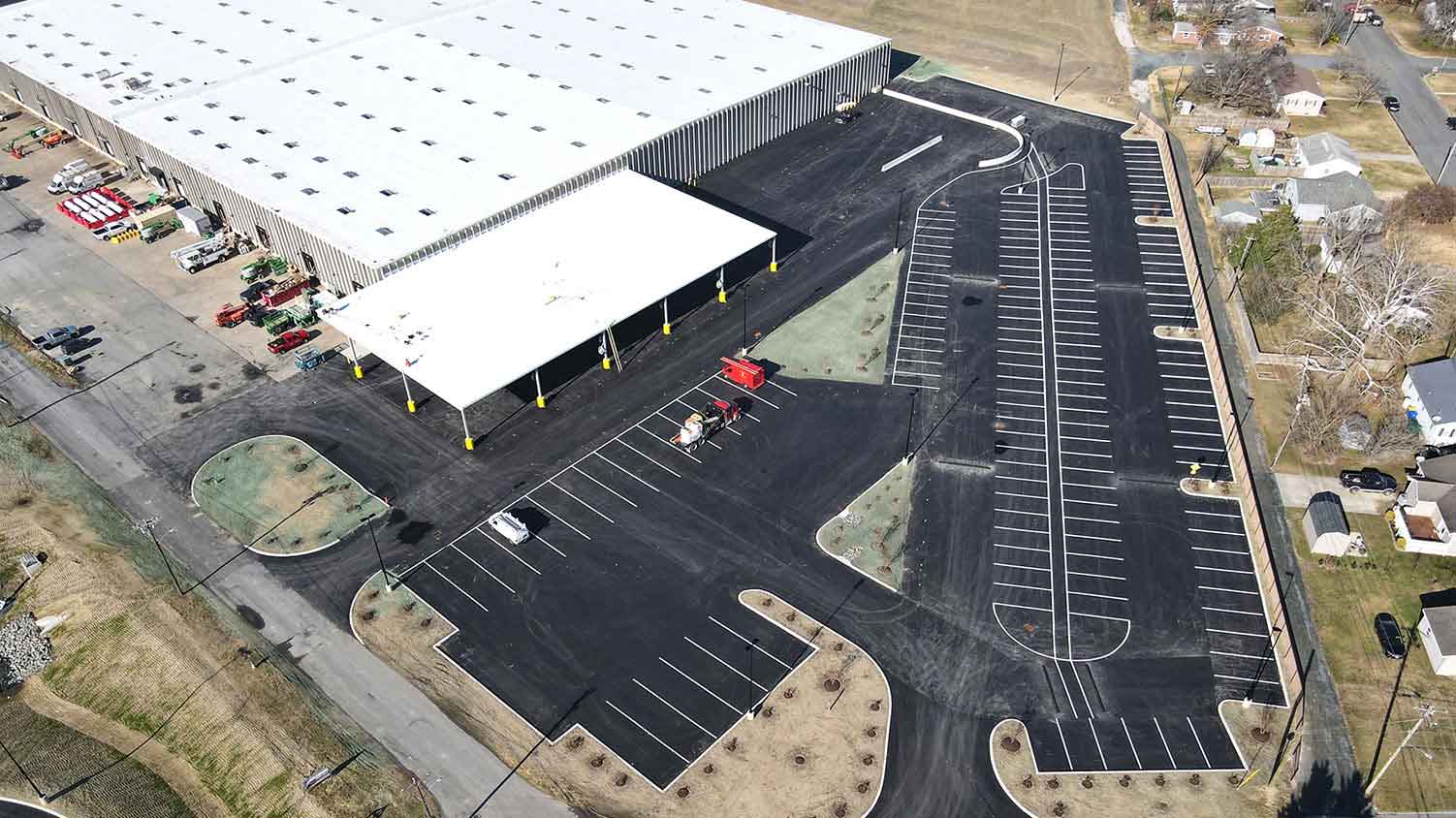 aerial view of a warehouse exterior and parking lot
