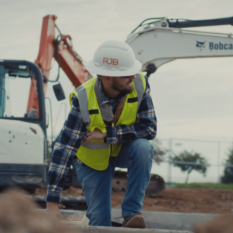 RJB Contracting employee kneeling down on a job site